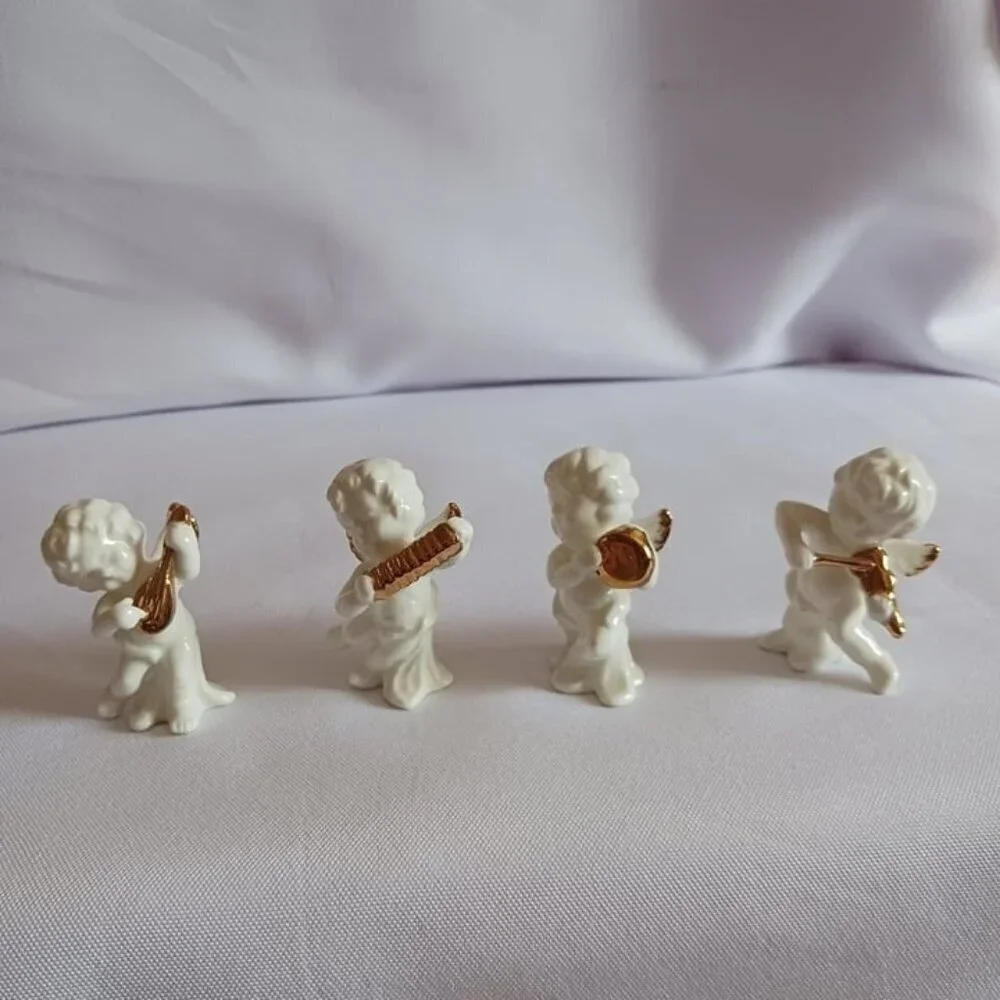 Bone china set of 4 angels gathered playing instruments
